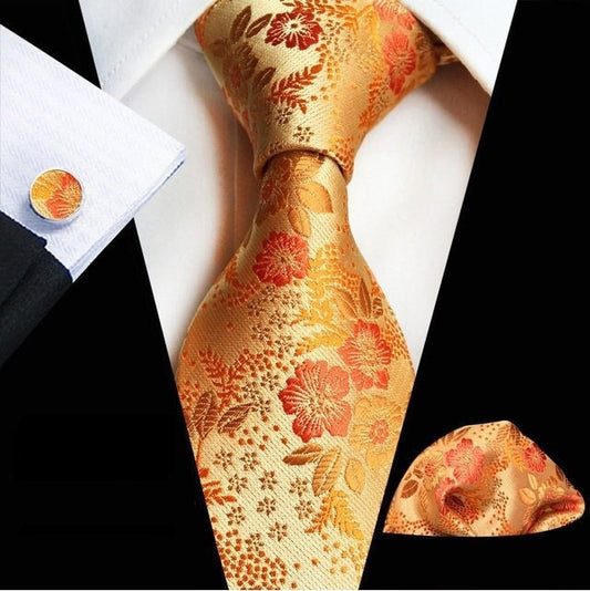 Cravate de luxe de couleur orange motif floral, fleuri, à fleurs, style tendance, en soie pour homme